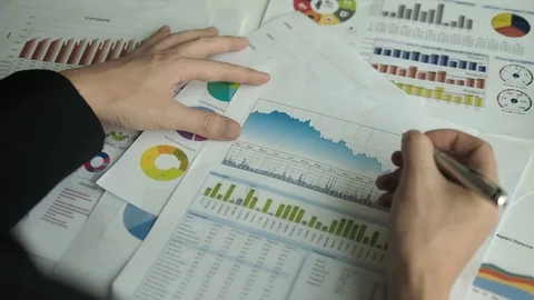 Man working with business graph in the office Stock Footage 87280553