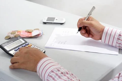 Man Working With Calculator Stock Photos