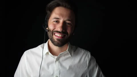 Man working for call center looking at the camera and smiling. Stock Footage 285090356