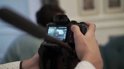 Man working with camera on tripod Stock Footage 73096180