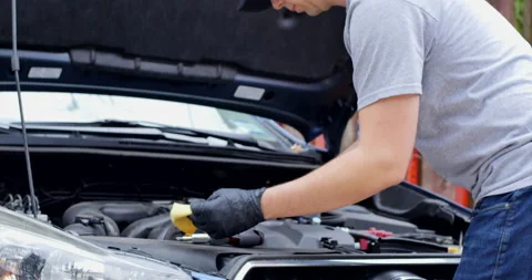 Man Working on Car Engine at Home Repair and Maintenance Concept Stock Footage 131688408