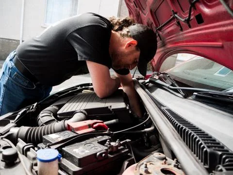 Man Working On a Car Stock Photos