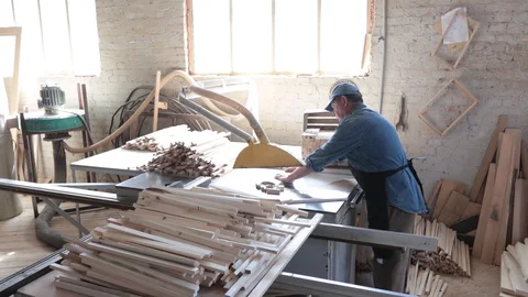 Man working as carpenter in his own woodshop. Stock Footage 128120116