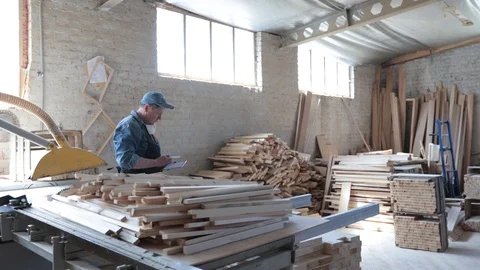 Man working as carpenter in his own woodshop. Stock Footage 128120245