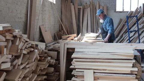 Man working as carpenter in his own woodshop. Stock Footage 128120299