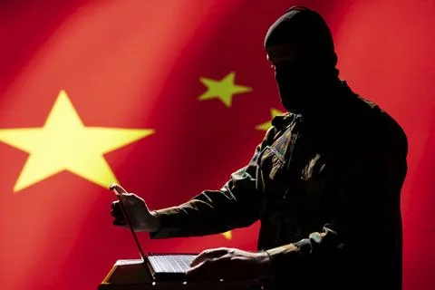 Man working for China intelligence corps coding troll farm promoting communism Stock-Fotos