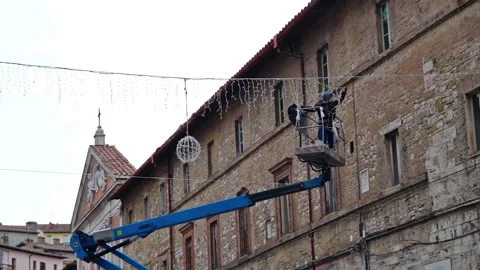 Man working christmas Light Stock Footage 167267393