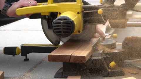Man working with circular blade saw for cutting wood beam. Stock Footage 239935663