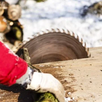 Man working with circular saw blade Stock Photos