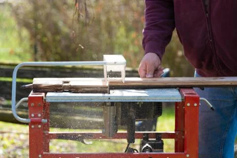 Man working with circular saw Stock Photos