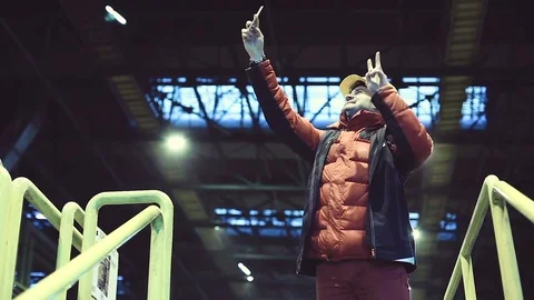 The man in working clothes makes selfie on the background of the plant Video stock 70840881