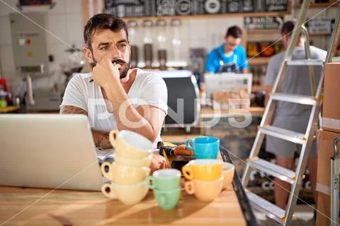 Man working at coffee shop - Coffee shop owner.. Stock Photos
