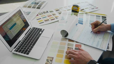 Man working with color samples for selection Stock Footage 104321317