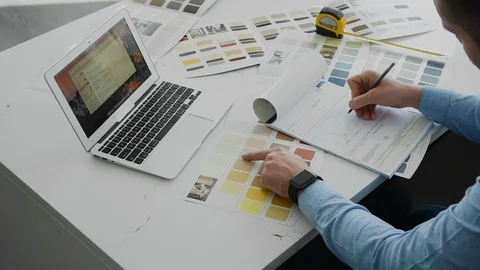 Man working with color samples for selection. Stock Footage 104321422