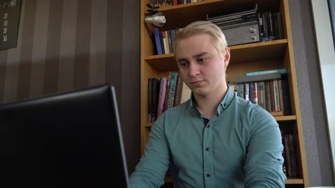 The man is working on the computer and made a mistake. Anger Stock Footage 86058084