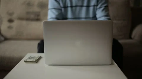 A man working at the computer and make money. Freelancer Stock Footage 47139884