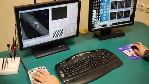 Man is working on the computer and zoom human hair from electronic microscope Stockbeeldmateriaal 76701278