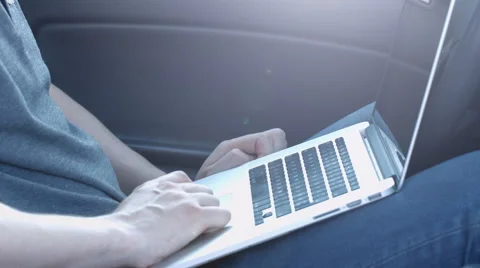 The man working at a computer in the car Видео 50177819