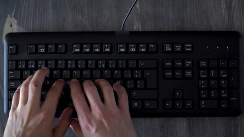 Man working with computer, closeup, hands typing, men's hands typing on keyboard Stock Footage 124360690
