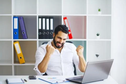 Man Working At Computer In Contemporary Office Stock Photos