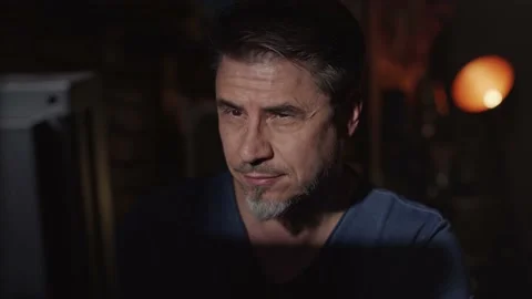 Man working on computer in dark room at home Stock Footage 148433383