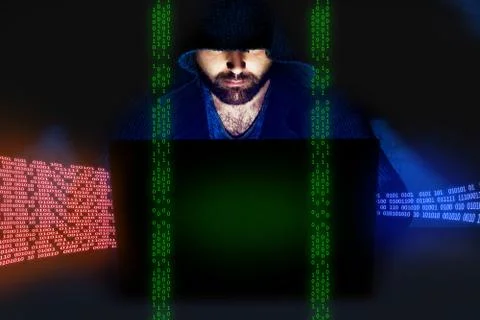 Man working at computer in dark room. Internet security concept Stock Photos