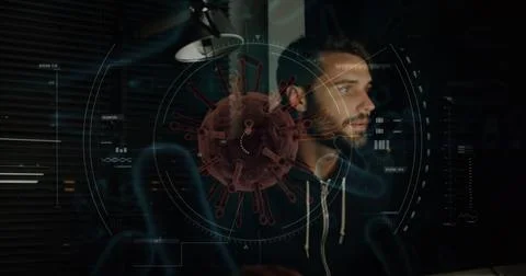Man working on computer with digital virus graphic overlay, focused on screen Stock Photos