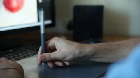 Man working on computer with Drawing tablet Stock Footage 91867807