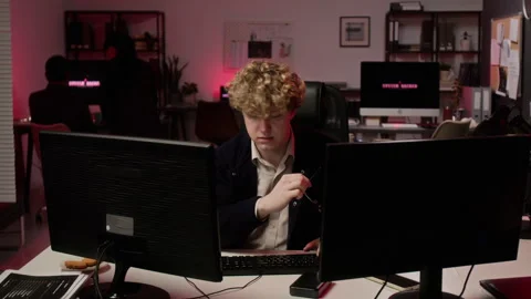 Man Working on Computer during Cyber Attack in Modern Office Stock Footage 347299434