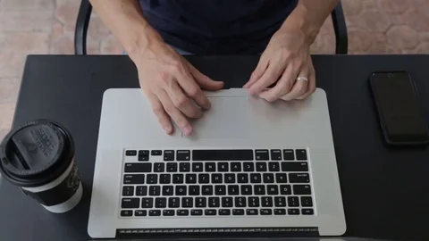 Man Working on Computer Get Text Message on iPhone Stock Footage 76484145