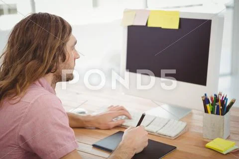 Man Working On Computer With Graphics Tablet