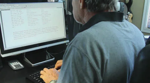 MAN WORKING AT COMPUTER AT HOME Video stock 22952523