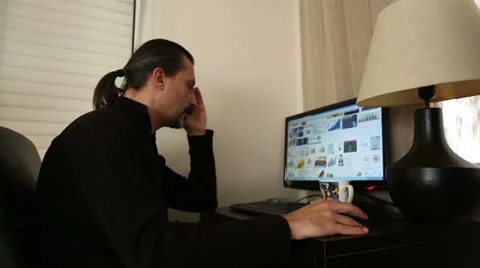 Man working computer at home  Stock Footage 33784389