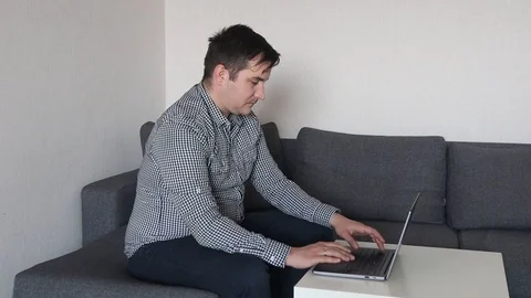 Man working on computer at home Video stock 126670908