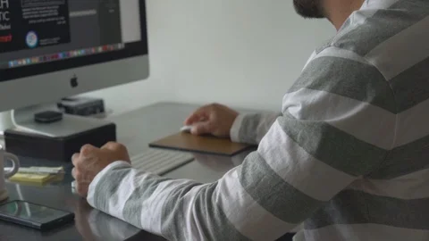 Man working on a computer at home Video stock 127906484