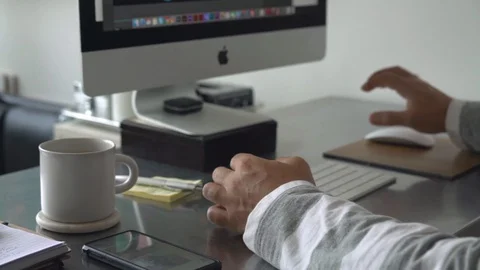 Man working on a computer at home Stock Footage 127906496