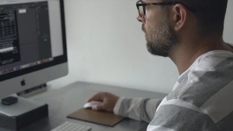 Man working on a computer at home 動画素材 127906511