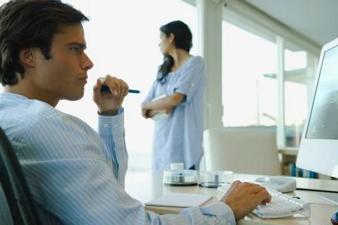 Man working on computer at home Stock Photos