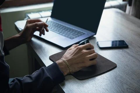 Man working in a computer at home. Stock Photos