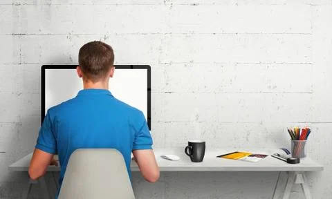 Man working on computer with isolated screen in office interior. Stock Photos