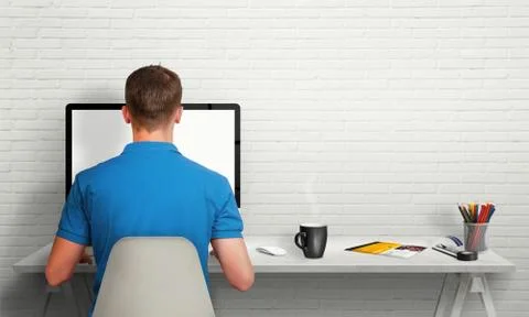 Man working on computer with isolated screen in office interior. Stock Photos