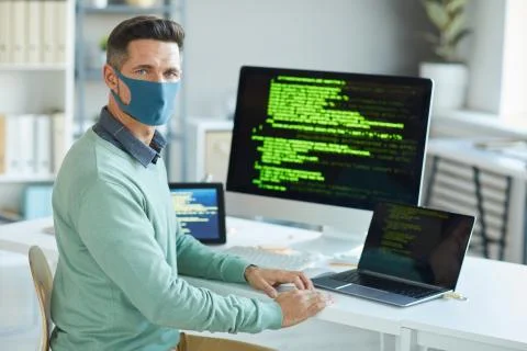 Man working on computer in IT office Stock Photos