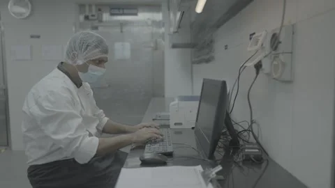 Man Working on Computer in Laboratory Wearing Medical Mask Stock-Footage 324052931