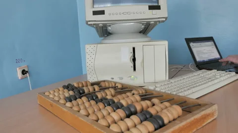 Man Working With Computer, Laptop And Abacus An Ancient Calculator Stock Footage 126375167