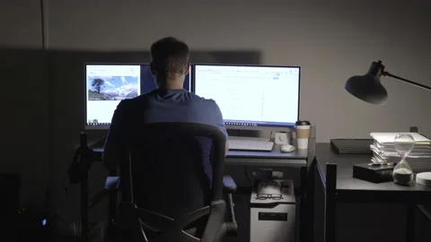 Man Working on a Computer Late at Night Stock Footage 208746285