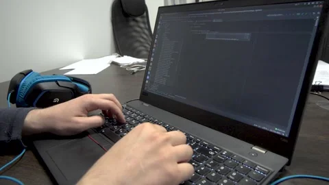 Man working on the computer, man is typing on keyboard , programmer coding Stock Footage 221232124