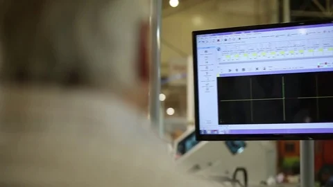 Man is working on a computer with a mock-up Stock Footage 72840192