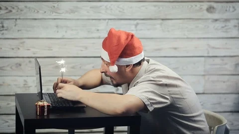 A man working at a computer in the new year Stock Footage 98334237