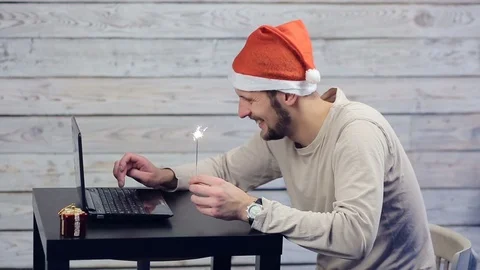 A man working at a computer in the new year Stock Footage 98729687