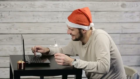 A man working at a computer in the new year Stock Footage 98729905